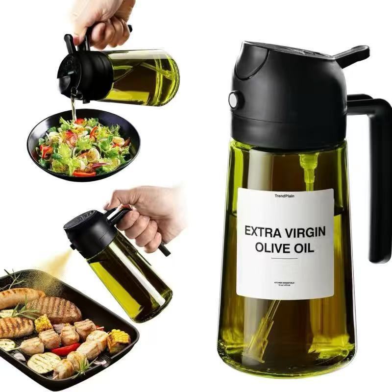 Black AeroMist oil sprayer misting grilled meat and pouring oil over a salad